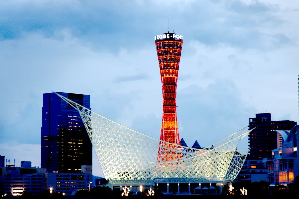 Kobe Port Tower and the Maritime Museum roof at dusk on a day trip from Kyoto