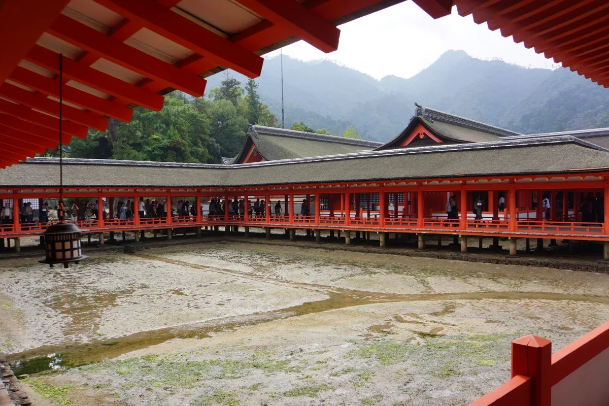 Itsukushima Shrine corridor at low tide on Miyajima on a Hiroshima and Miyajima day trip from Kyoto