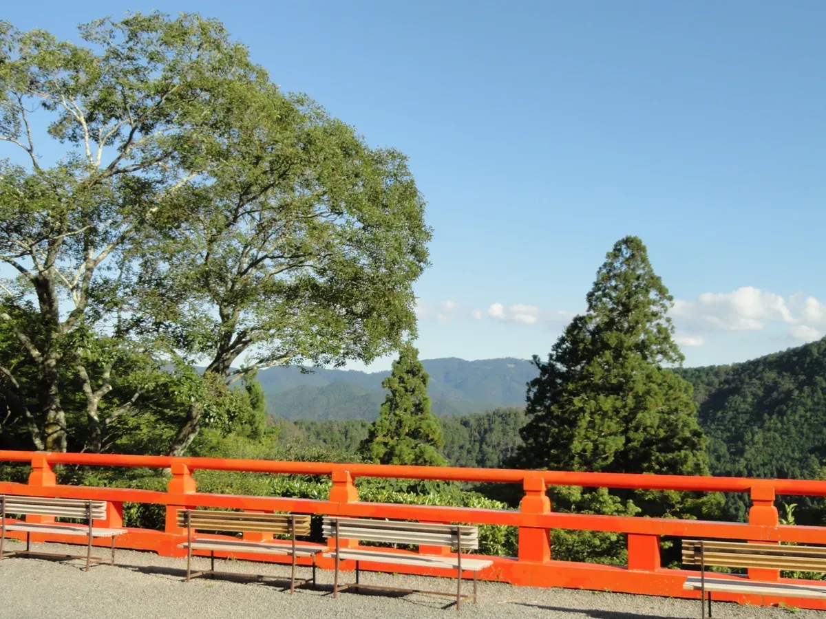 Kurama-dera railing above forested mountains on a Kurama and Kibune day trip from Kyoto